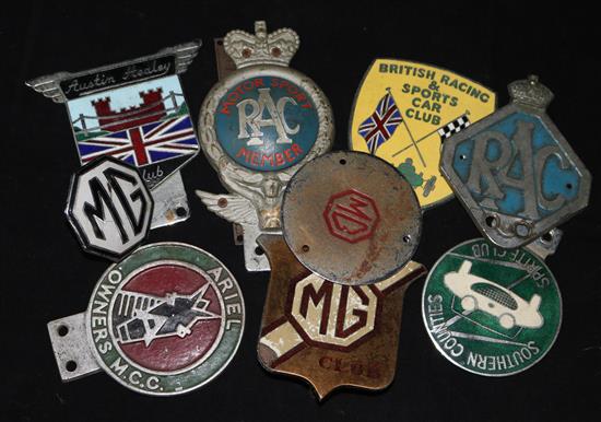 A collection of RAC, MG and other car badges